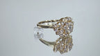 This is 1.20ct total weight natural diamond cluster cocktail ring in 14K yellow gold on a mirrored background rotating in a video.