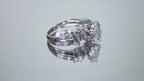This is a video of a 1.50ct total weight natural diamond ring in white gold from our estate collection shown slowly turning on a mirrored background.