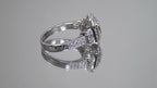 This is video of 1.56ct total weight natural emerald cut and round diamond ring in platinum shown rotating slowly on a mirrored background.