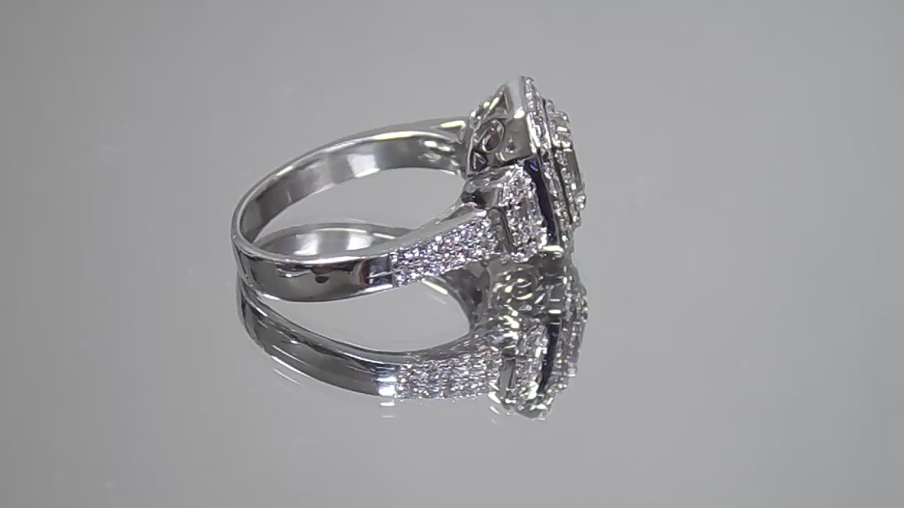This is video of 1.56ct total weight natural emerald cut and round diamond ring in platinum shown rotating slowly on a mirrored background.