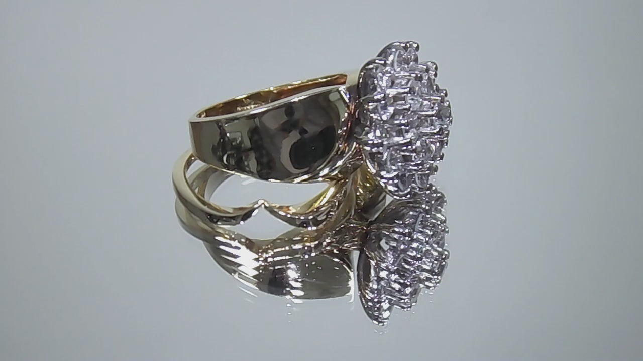 This is a video of a women's 1.50ct total weight natural diamond 2-piece wedding set with the engagement ring and matching diamond band in yellow gold shown slowly turning on a mirrored background.