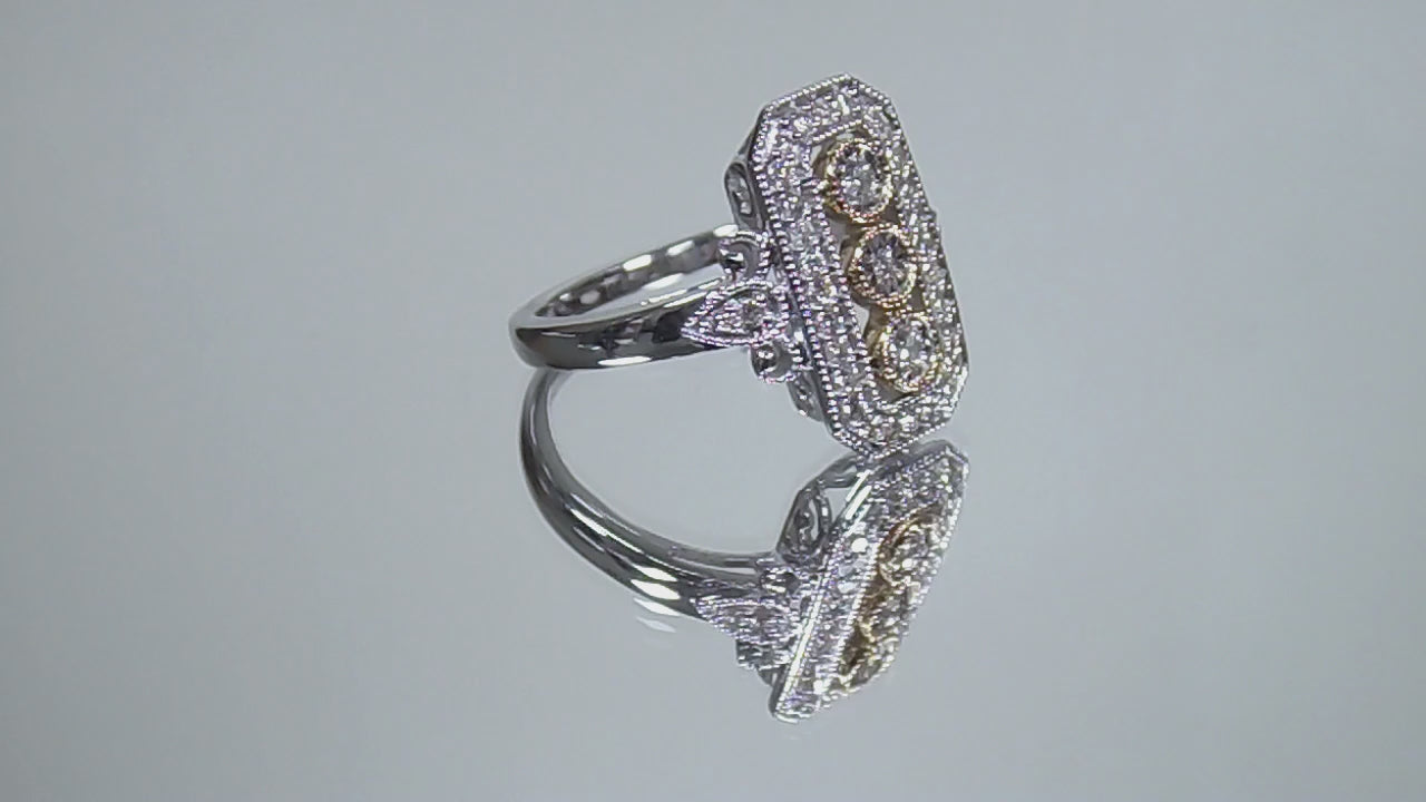 This ring is a filigree style natural diamond ring with a total of .37ct natural diamonds in 2-tone white and yellow gold on a mirrored background rotating in a video.
