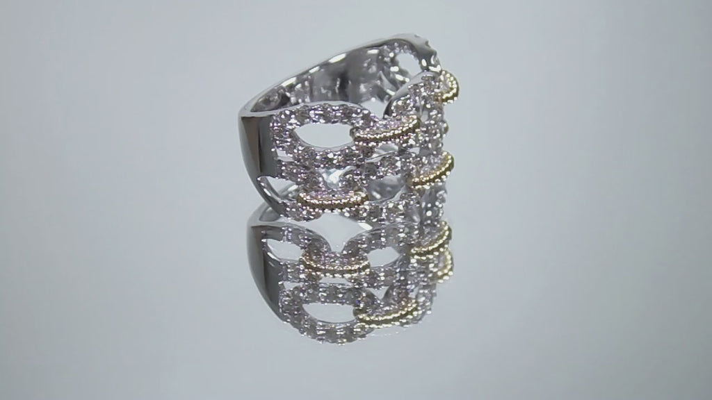 1.50ct double row two tone white and yellow gold natural diamond band rotating in a video on a white background.