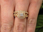 This is a 2pc 1.25ct total weight natural diamond princess cut wedding set with engagement ring and matching band in rose gold shown on a woman's finger.