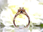 This is a side view of a 2pc 1.25ct total weight natural diamond princess cut wedding set with engagement ring in rose gold with yellow flowery backgound.