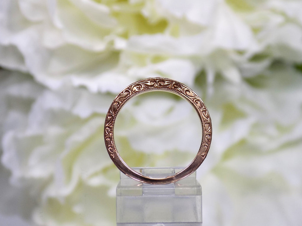 This is a side view of the matching band to a 2pc 1.25ct total weight natural diamond princess cut wedding in rose gold with yellow flowery backgound.