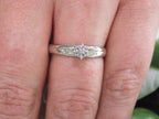 Women's Shows small preowned diamond ring in white gold.