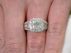 This is 3.68ct total weight natural diamond ring with a 2.05ct natural princess cut set in a legendary designer Simon G white gold mounting shown on a woman's finger.