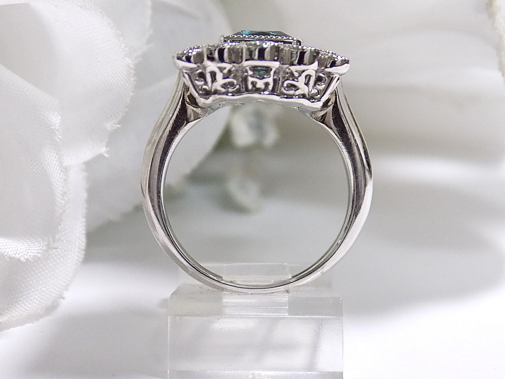 This is a women's 1.78ct total weight natural indicolite tourmaline and diamond Victorian style ring in white gold with a white background.