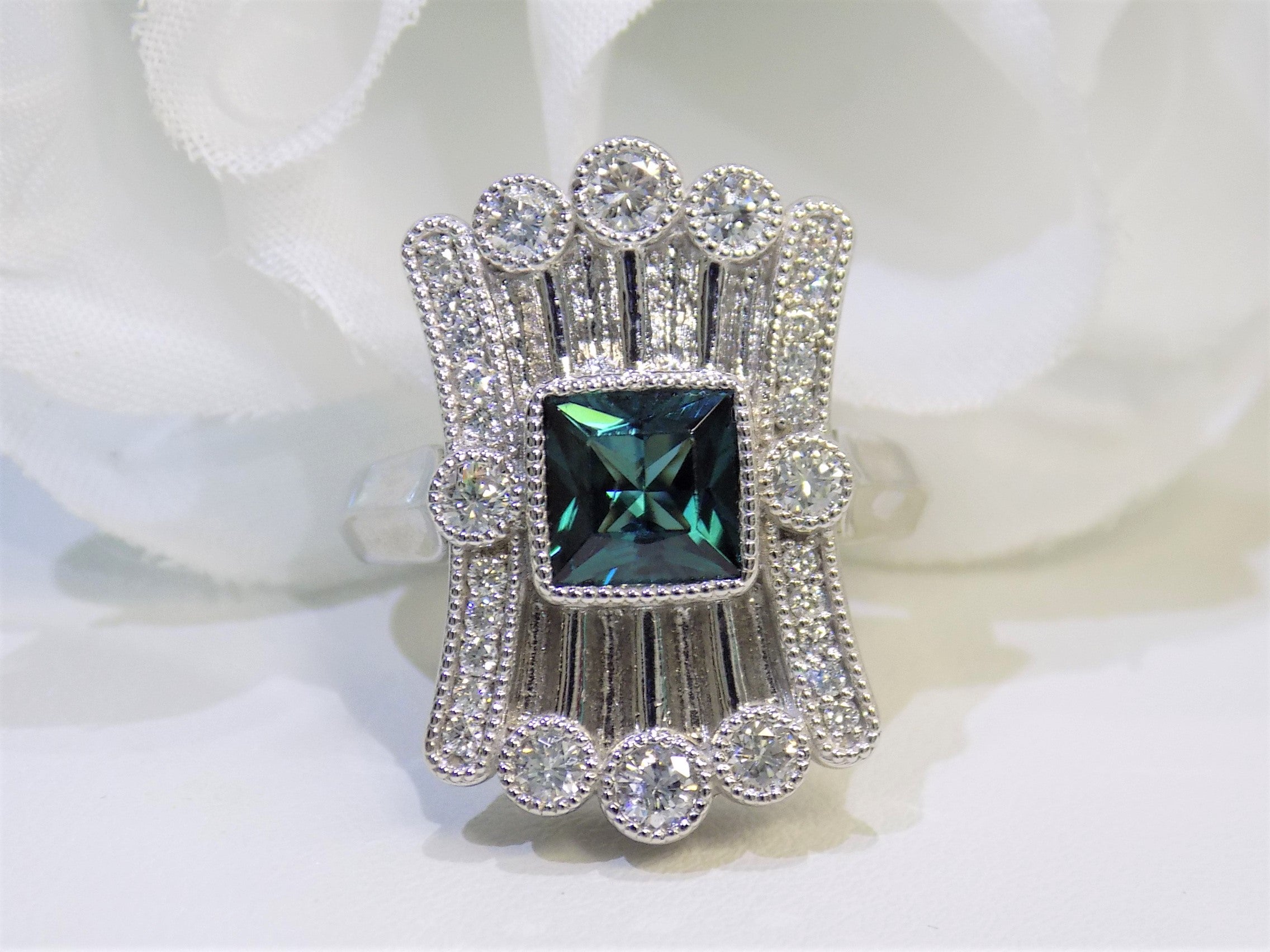 This is a women's 1.78ct total weight natural indicolite tourmaline and diamond Victorian style ring in white gold with a white background.