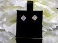 This is a pair of earrings in Van Cleef style with natural diamonds win 2 tone white and yellow gold.