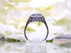 This is a side view of a 7 stone .10ct Total Weight Natural Diamond Vintage Ring in 14K White Gold.