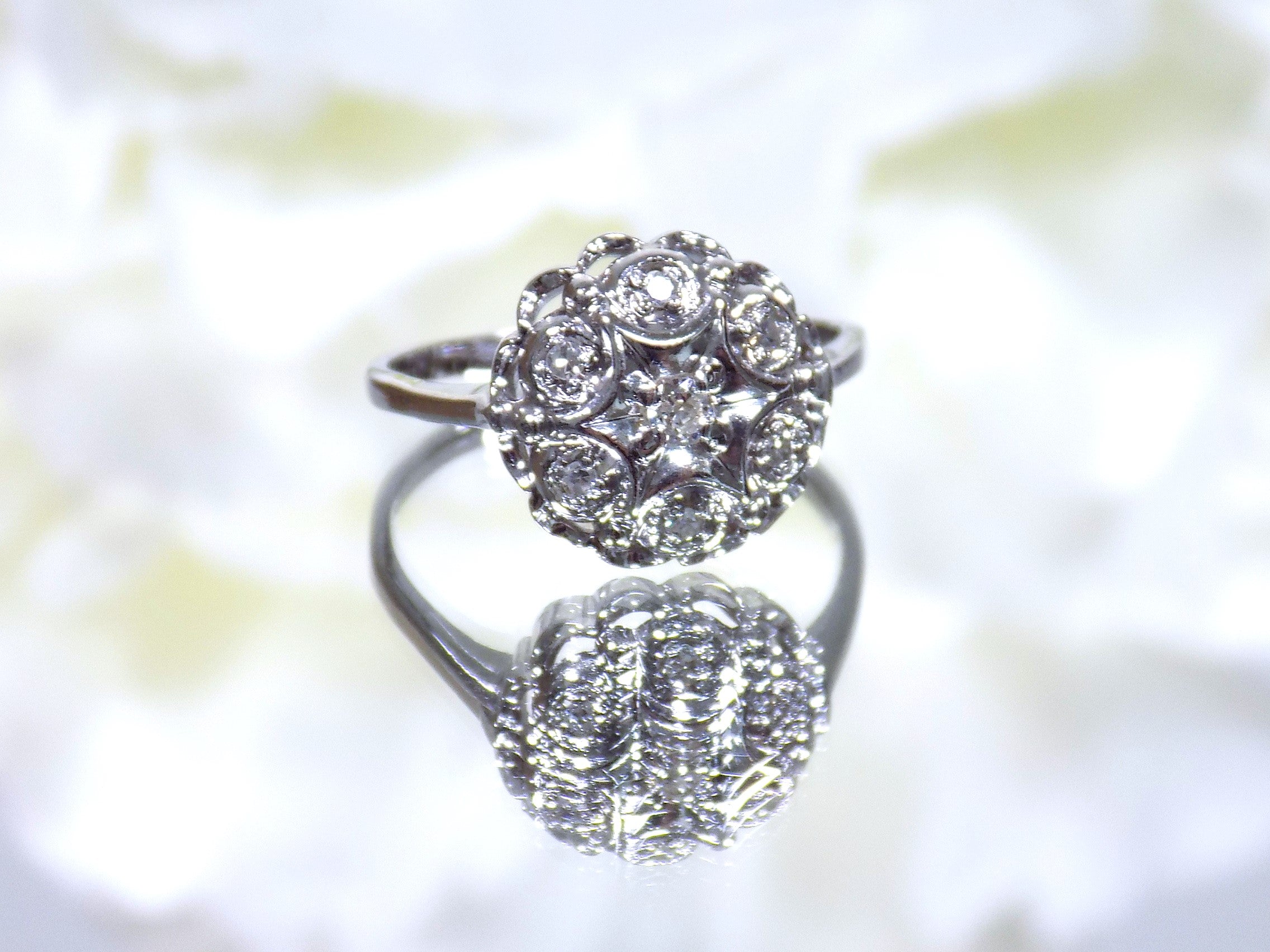 This is a 7 stone .10ct Total Weight Natural Diamond Vintage Ring in 14K White Gold.