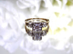 This is a Vintage .59ct ladies natural diamond wedding ring in yellow gold with a white background.
