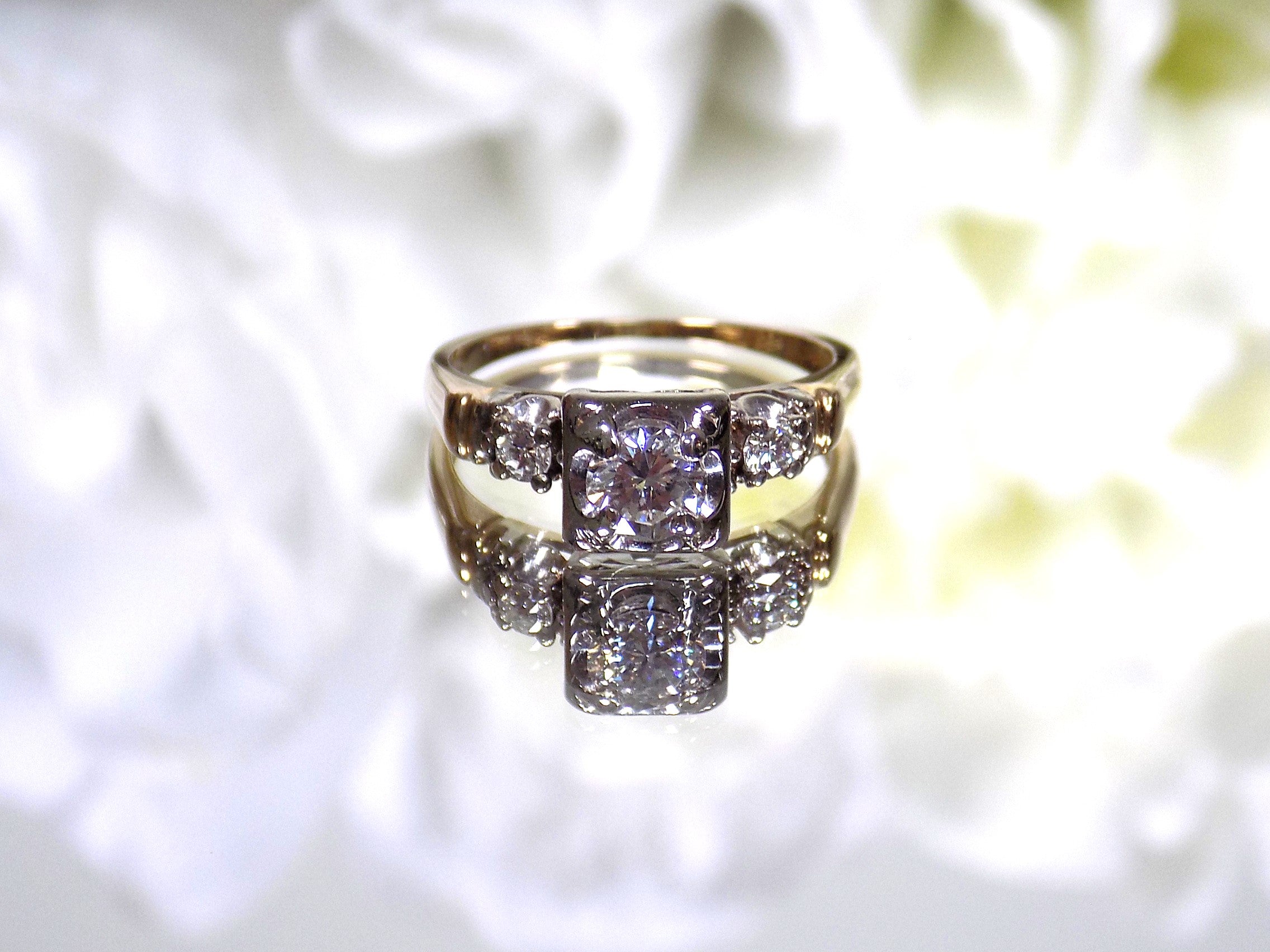 This is a Vintage .59ct ladies natural diamond wedding ring in yellow gold with a white background.