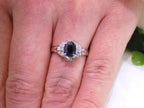 This is women's a vintage pre-world war II genuine oval shape sapphire and natural diamond ring 1.36ct total weight in platinum restored to showcase condition shown on a woman's finger