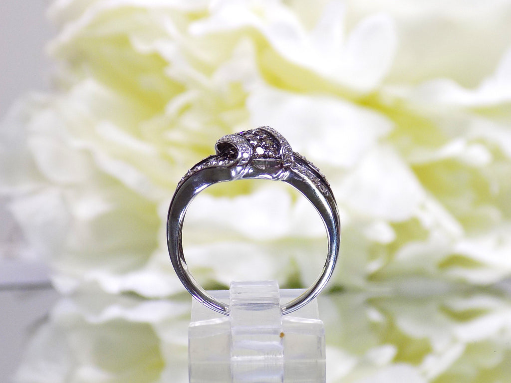1.00ct white and chocolate diamond ring in white gold from a side view.