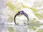 1.00ct white and chocolate diamond ring in white gold from a side view.