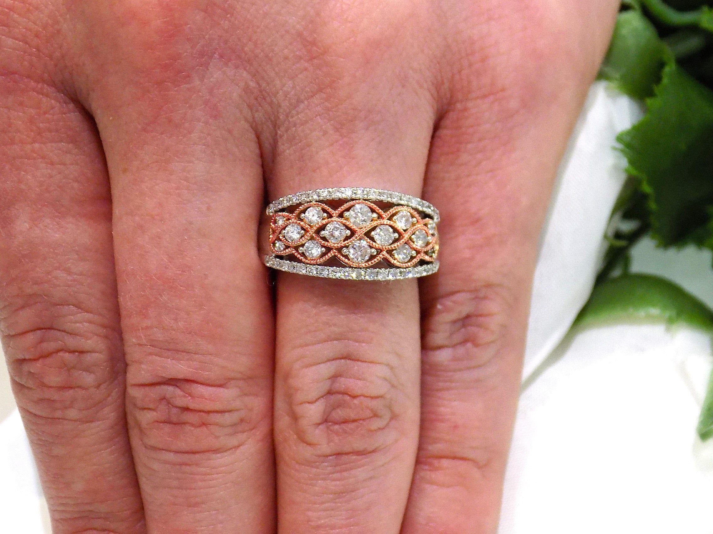 14K White and Rose Gold .75ct Diamond Band on a ladies finger.